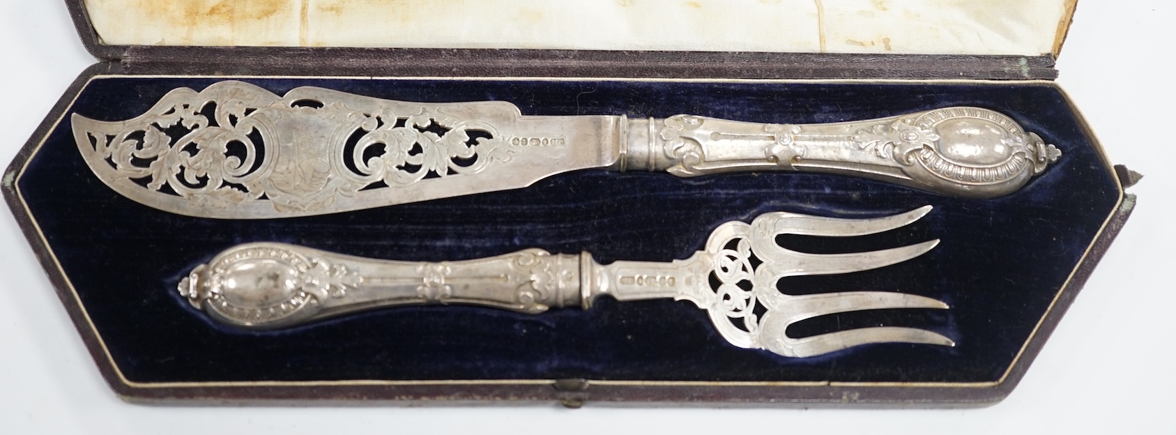 A cased pair of Victorian silver fish servers, Atkin Brothers, Sheffield, 1861, knife 32.4cm. Condition - poor to fair